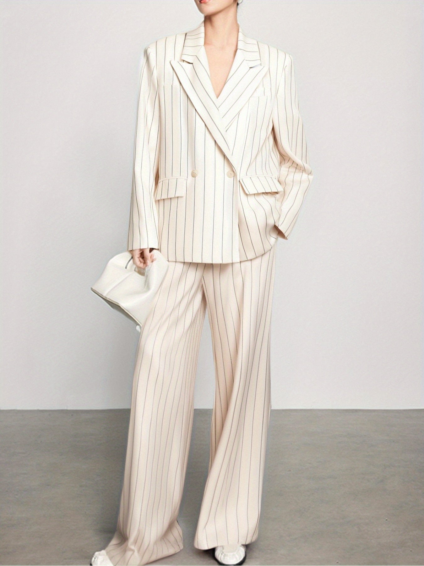 Spring-Summer New Women'S Suit Set with a Turned- Collar And Thin Stripes, Featuring a Double-Breasted Design for The Blazer And Wide-Leg Pants. It exudes a Professional And Elegant Look, Perfect for Office Commute, Business Events, And Formal Gatherings.