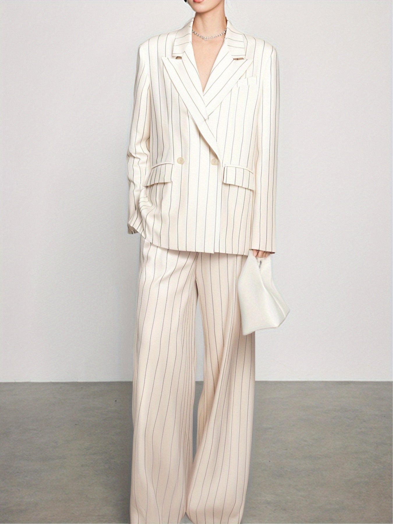 Spring-Summer New Women'S Suit Set with a Turned- Collar And Thin Stripes, Featuring a Double-Breasted Design for The Blazer And Wide-Leg Pants. It exudes a Professional And Elegant Look, Perfect for Office Commute, Business Events, And Formal Gatherings.