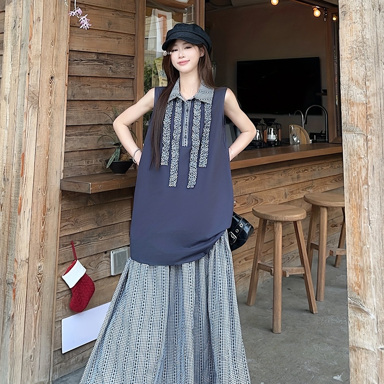 New Summer Loose Sleeveless Top with Retro Plaid Color-Blocking And Ruffled Collar, Paired with a Plaid Skirt for a Casual Two-Piece Set.