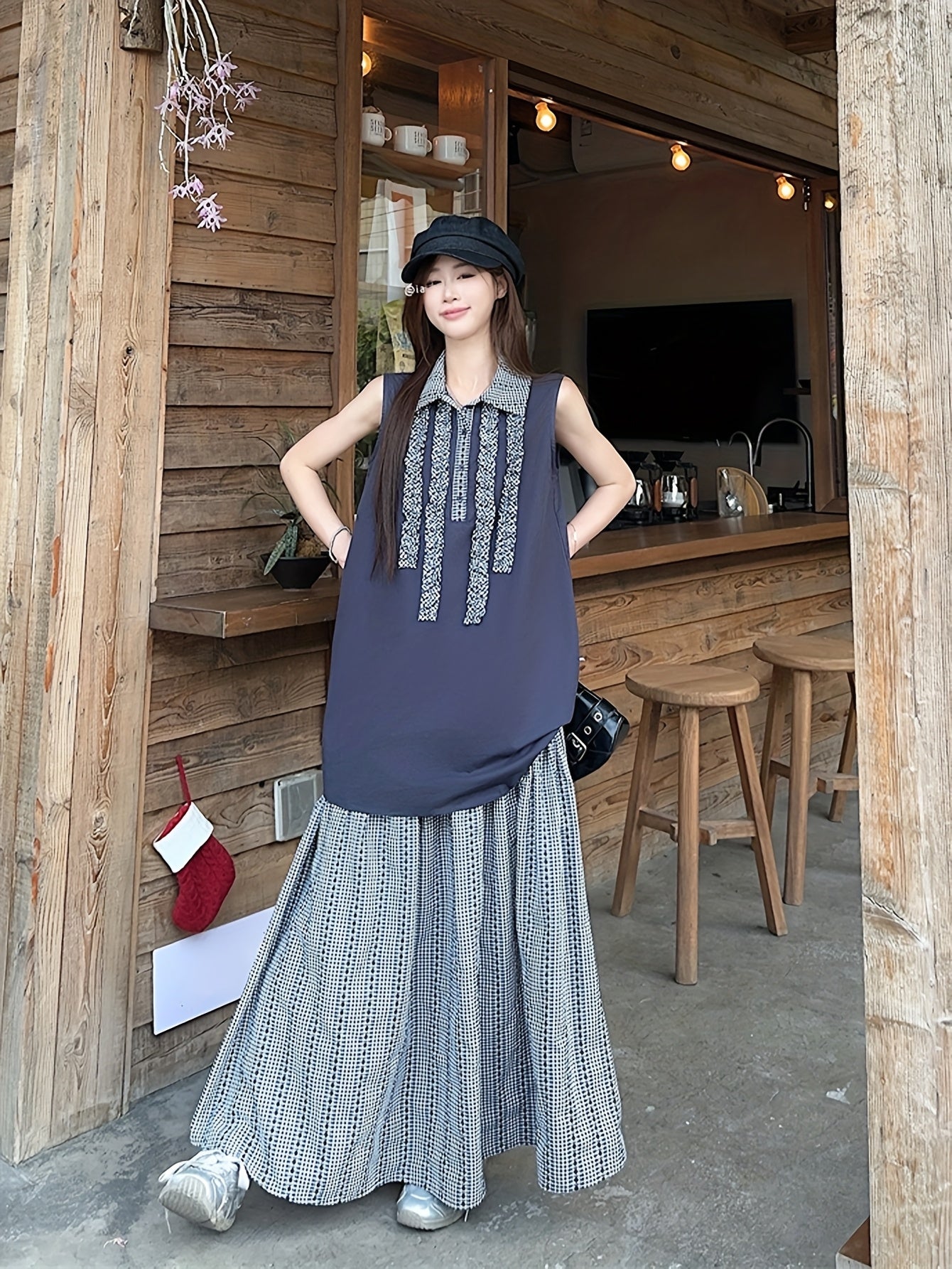 New Summer Loose Sleeveless Top with Retro Plaid Color-Blocking And Ruffled Collar, Paired with a Plaid Skirt for a Casual Two-Piece Set.